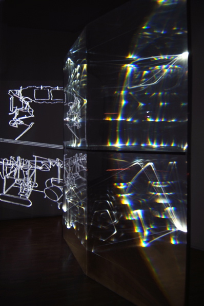 CARLO BERNARDINI, GHOST OF DUCHAMP 2009, Fiber optic, plexiglass, OLF surface, video, feet h 9,5x5x1,5; Museo d’arte, Villa Ciani, Lugano.